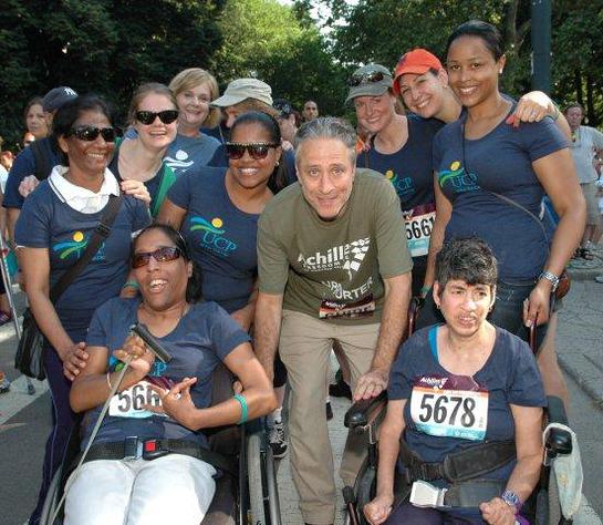 Photo: Jon Stewart POSES WITH TEAM UCP IN CENTRAL PARK AT THE ACHILLES HOPE & POSSIBILITY RACE. (Photos by Lois Silver.)