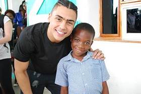 Quincy Brown with Smile Train patient in Cap Haitien, Haiti.