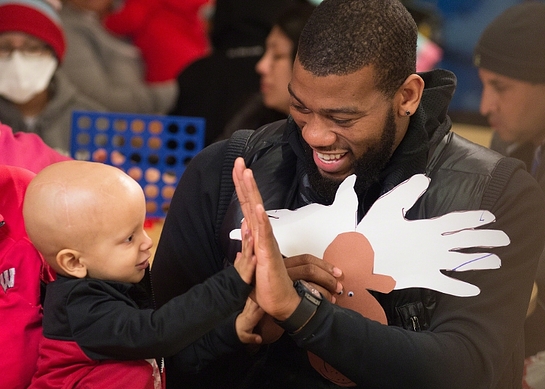 Greg Monroe of the Milwaukee Bucks shares a special moment with St. Jude patient Colton during a recent team visit to St. Jude Children's Research Hospital