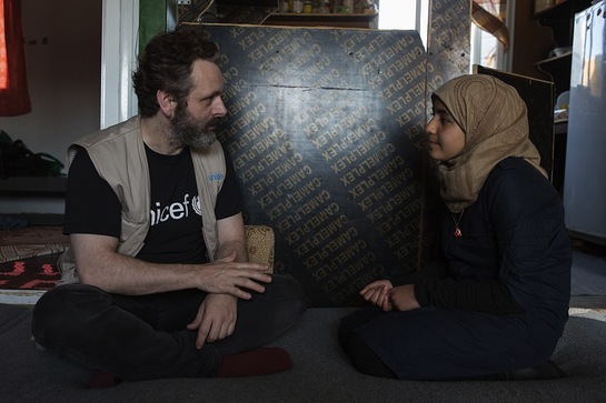 Michael Sheen talking to 13-year-old Omaymah, who has been campaigning for girls' education.