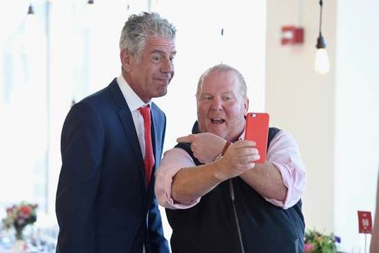 Mario Batali and Anthony Bourdain pose for a selfie during The (RED) Supper, sponsored by Josh Cellars