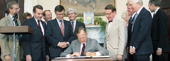 President George H.W. Bush signs the National Literacy Act into law