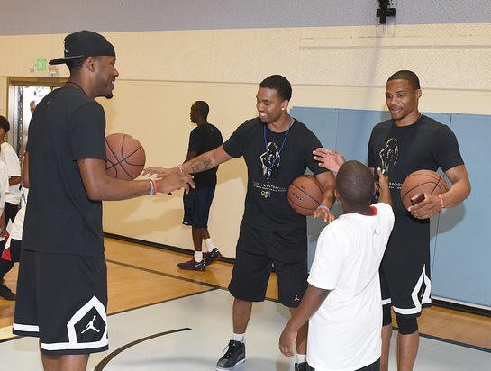 Russell Westbrook teaches kids at the Russell Westbrook Why Not? Basketball Camp at Jesse Owens Community Regional Park