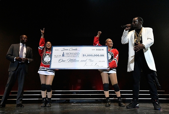 Sean Combs presents his Alma Matter Howard University's President Wayne A.I. Frederick, M.D., MBA with one million dollar check