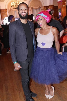 After visiting the crafting fun house hosted by title sponsor Michaels Stores, Monique Coleman can't stop the feeling as a cheerful Troll with husband Walter Jordan at Dream Halloween