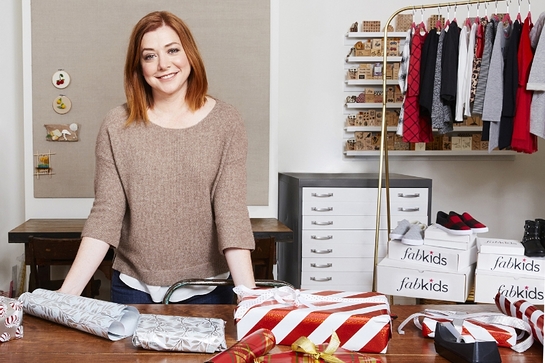 Alyson Hannigan and family graciously turned their home into Santa's workshop to package FabKids shirts, pants, dresses, hats, and accessories