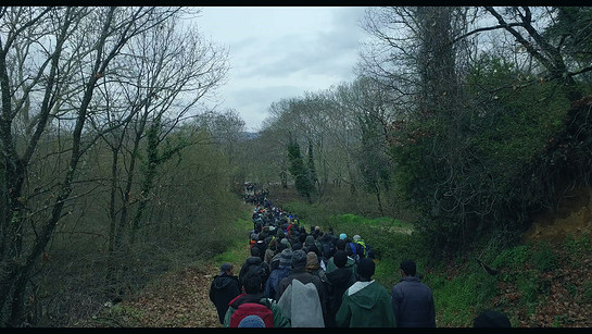 Walking refugees near Idomeni Camp in Greece