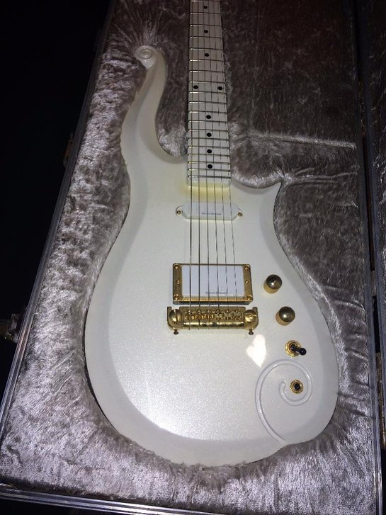 Bid live online on Proxibid for Prince's touring practice guitar, gifted to his former bodyguard