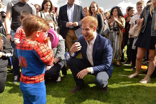 Prince Harry Meets Kids At Royal Party