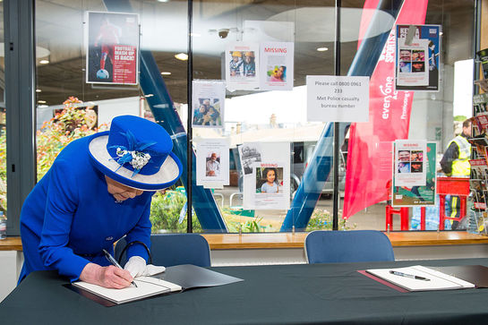The Queen Signs Book Of Condolence