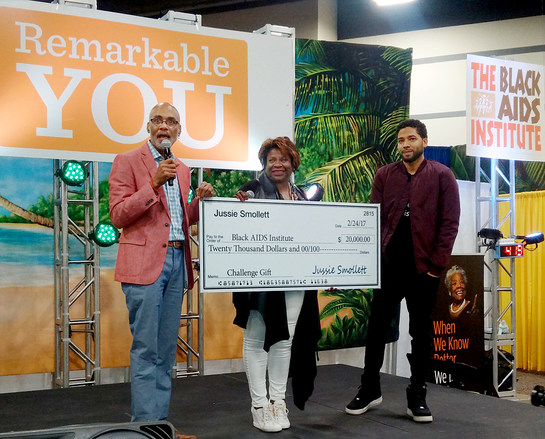 Jussie Smollett with Black AIDS Institute President and CEO Phill Wilson and Board Chair Grazell Howard