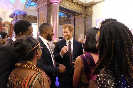 Prince Harry joined Her Majesty at Buckingham Palace as The Commonwealth's young leaders were presented with medals for their service to their community