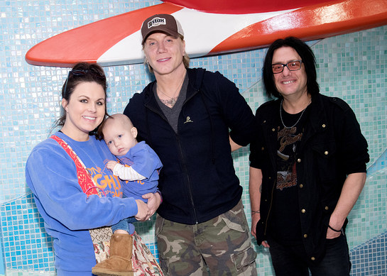 John Rzeznik and Robby Takac share a special moment with a patient family during their visit to St. Jude Children's Research Hospital