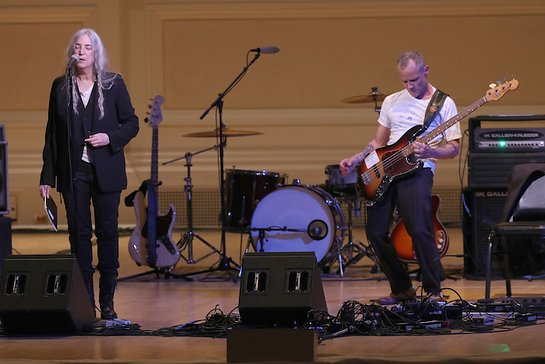 Patti Smith and Flea perform on stage during Pathway To Paris Concert For Climate Action at Carnegie Hall