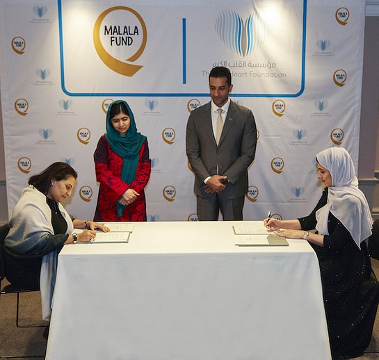 Sheikh Sultan bin Ahmed Al Qasimi and Malala Yousafzai witnessing the signing between TBHF and Malala Fund