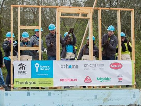 Drew and Jonathan Scott help future homeowners Ashlee and Amanda raise the walls of their new homes in Nashville