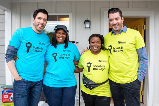 Drew and Jonathan Scott with future Habitat homeowners Amanda and Ashlee