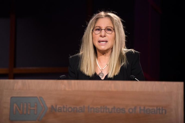 Barbra Streisand at the lectern for the J. Edward Rall Cultural Lecture