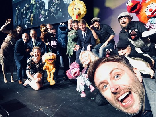 Host Chris Hardwick takes a selfie with the cast of Puppets for Puppetry