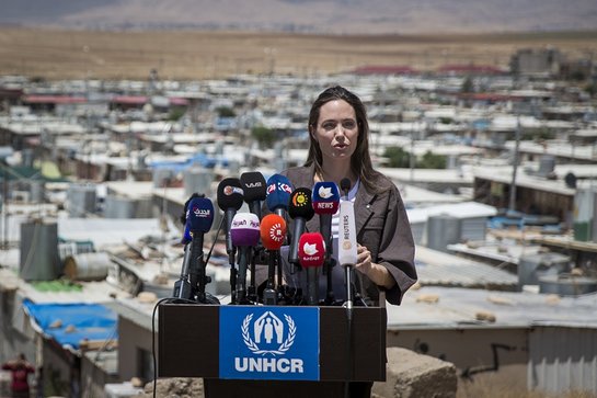 Angelina Jolie speaking to journalists at Domiz refugee camp in Iraq