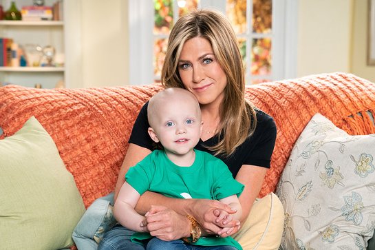 Jennifer Aniston smiles alongside St. Jude Children's Research Hospital patient Hadley