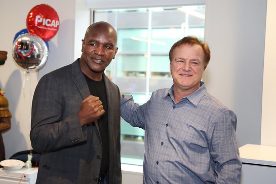 Evander Holyfield raising money for Heart 9/11 and FCI Academy FDN during the Annual ICAP Charity Day