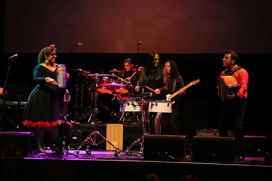 Sheila E. performing with La Santa Cecilia