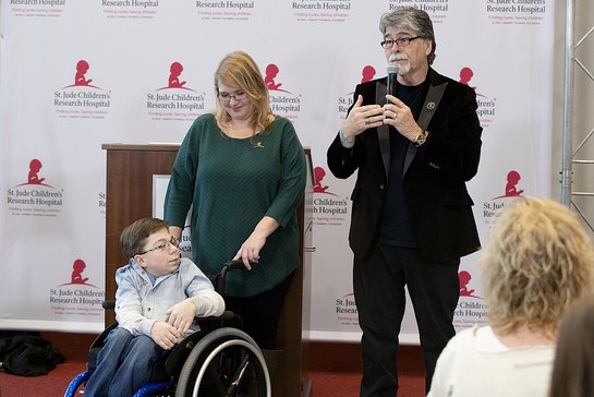 St. Jude patient Caleb and his mother Kelly help honor musician Randy Owen