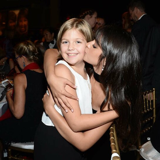 Camila Cabello shares a moment with Hope, a Save the Children program participant from Kentucky