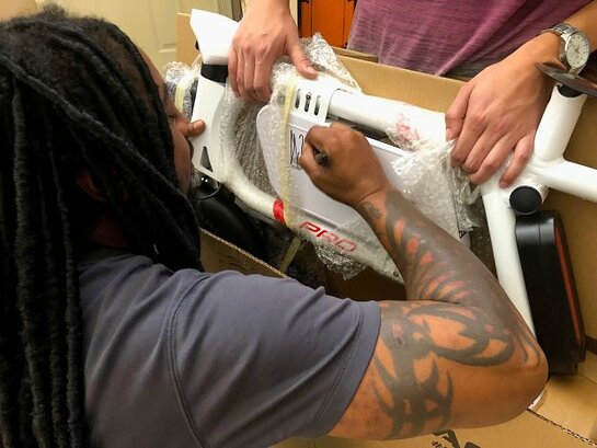 Lajon Witherspoon of Sevendust signs a SWAGTRON Swagcycle Pro.