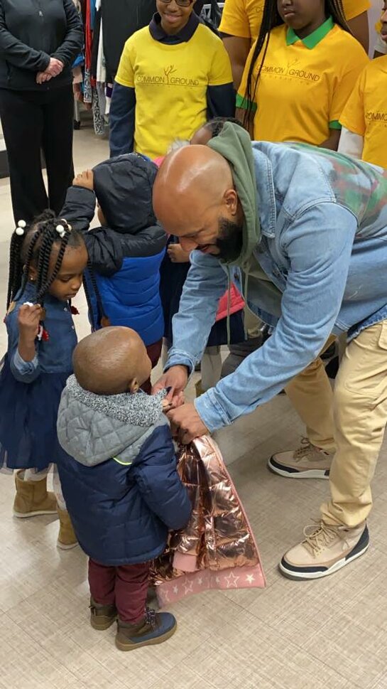 Common meets kids at the Burlington Coat Drive in Chicago.