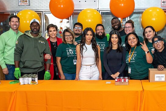 Kris Jenner, Kim Kardashian West, Kourtney Kardashian and Corey Gamble joined volunteers from the Los Angeles Regional Food Bank.