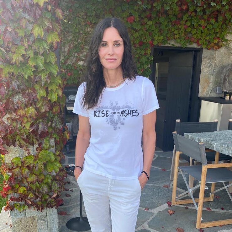 Courteney Cox in her #RiseFromTheAshes T-shirt