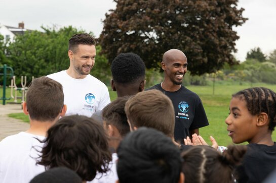 Liam Payne and Mo Farah visit a school in London to take part in the Soccer Aid Schools Challenge