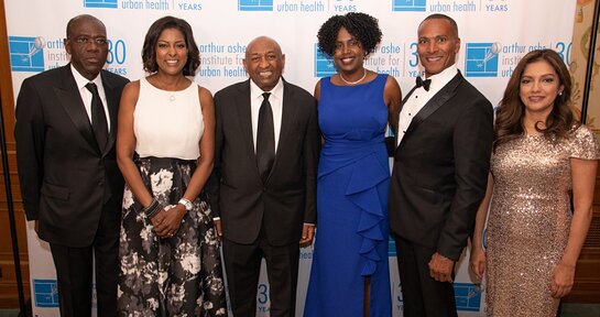 Honorees Anthony Welters, Lori Stokes, Kitaw Demissie MD; AAIUH CEO Dr. Marilyn Fraser; Hosts Mike Woods and Ines Rosales