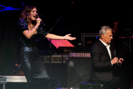 Katharine McPhee and David Foster perform onstage during the 37th Annual Carousel Ball