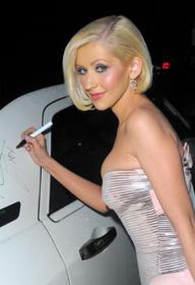 Christina Aguilera signs car Christina Aguilera signs car