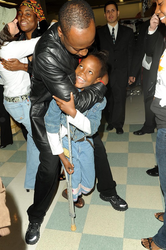 Wyclef Jean with Haitian Amputee at Kmart