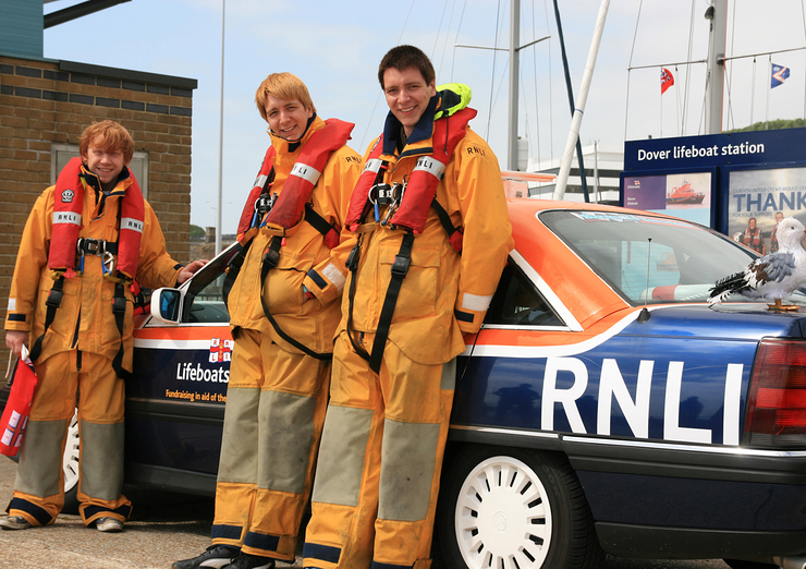 Rupert Grint, Oliver & James Phelps by their RNLI lifeboat car prior to the Barmy to Barcelona Wacky Rally