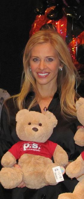 Dina Manzo of The Real Housewives of New Jersey & Project Ladybug with one of the 386 teddy bears donated by P.S. Aeropostale 