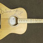 Christmas Gift Idea: Bruce Springsteen Signs Guitar For Charity Auction