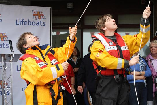 Celia Imrie and volunteer crew Max Rimmington raise the appeal flag