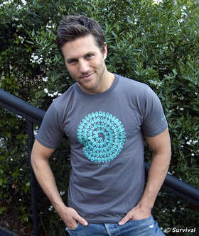Ross Thomas modeling Survival's new T-Shirt designed by Richard Long.