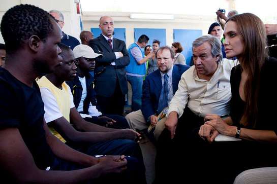 UNHCR chief António Guterres and Goodwill Ambassador Angelina Jolie talk with asylum-seekers on the Italian island of Lampedusa.