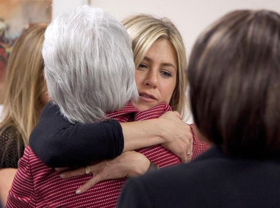 Jennifer Aniston, hugs Health and Human Services Secretary Kathleen Sebelius during an event at the Inova Breast Care Center (AP Photo/Carolyn Kaster)