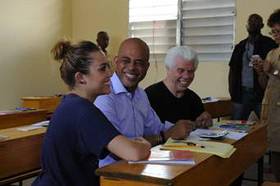 Miley Cyrus with Haitian President Michel Martelly and Bill Austin, Founder of Starkey Hearing Foundation during her second trip to Haiti with the Foundation.