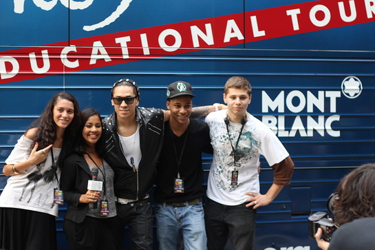 Taboo meets students outside the John Lennon Educational Bus