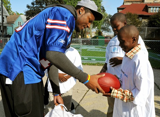 Buffalo Bills star wide receiver Stevie Johnson hands out football gear