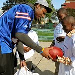 NFL Star Hands Out Football Gear To Kids In Need