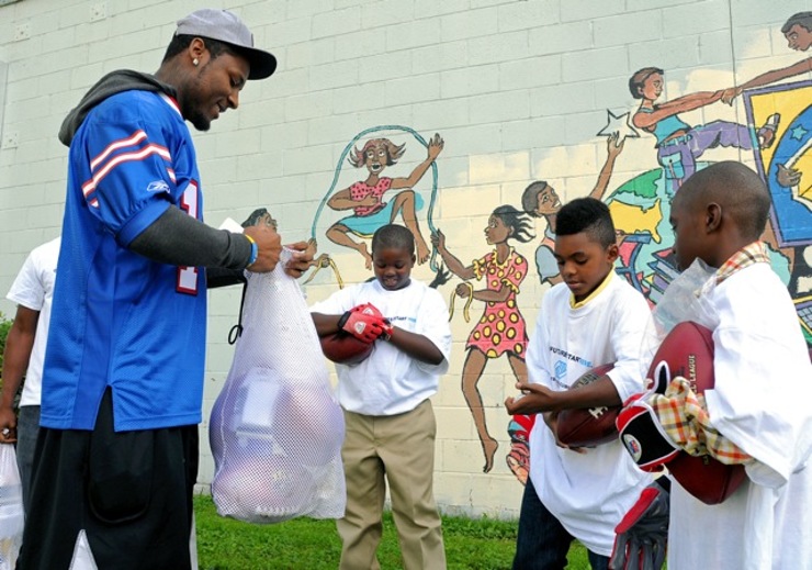 Buffalo Bills star wide receiver Stevie Johnson hands out football gear